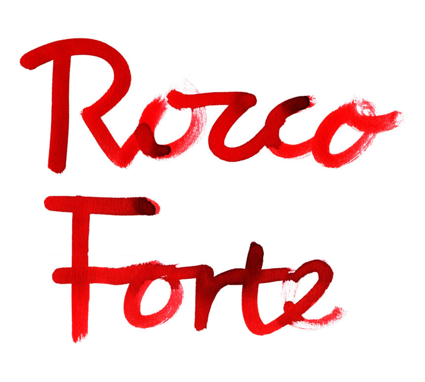 Writing with red brush strokes;